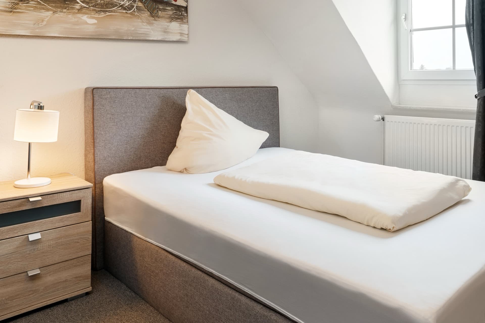 Einzelzimmer mit Gemeinschaftsbad im Hotel Romäus